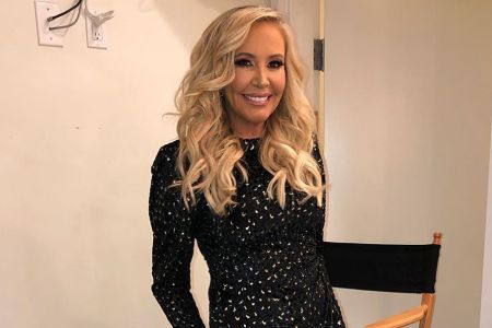 Shannon Beador poses a picture in a lovely black dress.